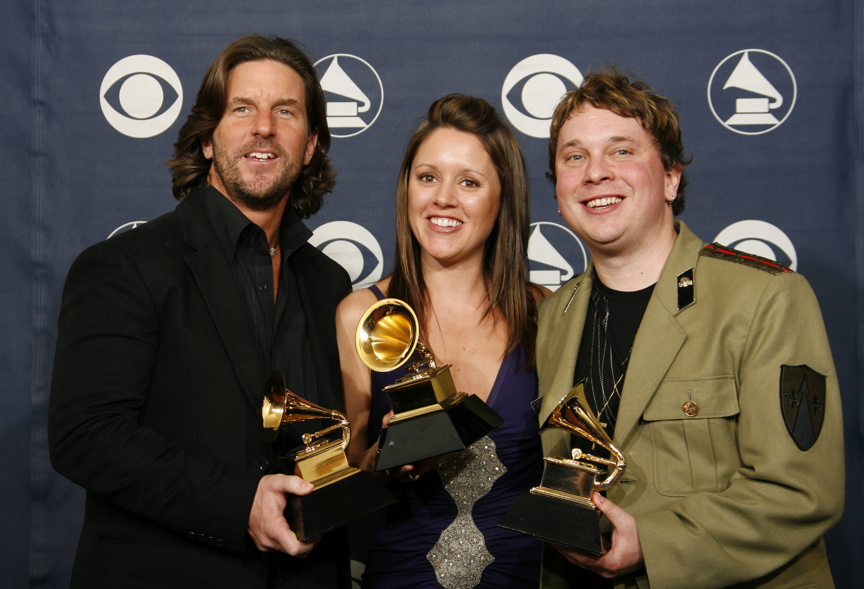 Brett James, from left, Hillary Lindsey and Gordie Sampson hold their award for best country song, "Jesus Take the Wheel," at the 49th Annual Grammy Awards in Los Angeles. (AP)